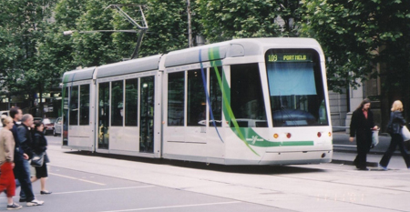 An LRT vehicle traveling throught the streets of Melbourne, Australia.