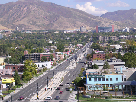 An aerial view of an LRT line in Salt Lake City, Utah showing the transit-only centre lane tracks on which vehicles travel.