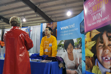 Team vivaNext member, Donald Chang, speaks with a woman interested in the rapidways coming to York Region Friday at the Home Show.