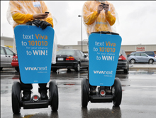 Two members of our segway team texting to win. When you see them near Vaughan Mills Mall this weekend ask how you could win the new iPod nano®.