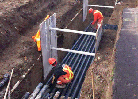 Underground conduit being installed